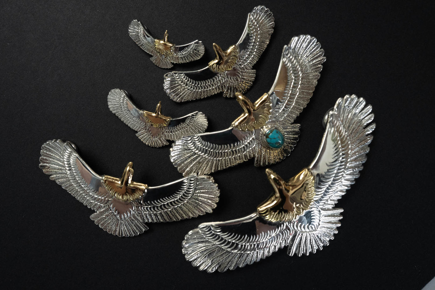 FIRST ARROW'S EAGLE PENDANTS WITH 18K GOLD HEAD